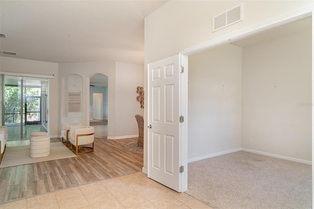 5405 98th Ave E, Parrish, FL 34219 - empty room featuring arched walkways and light tile patterned floors