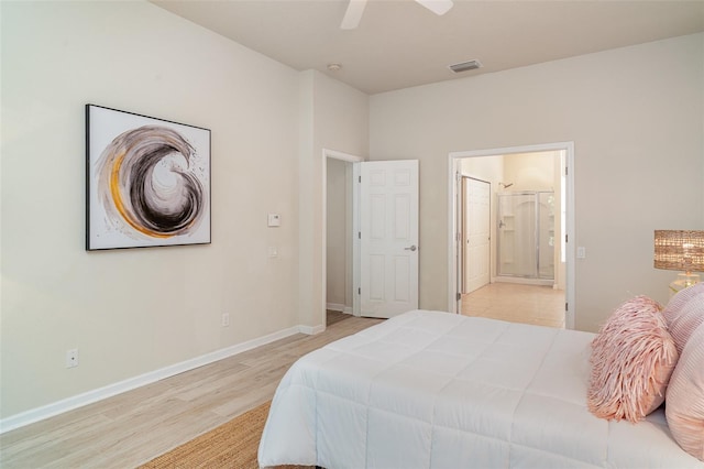 5405 98th Ave E, Parrish, FL 34219 - bedroom featuring light wood-style floors, ensuite bathroom, and a ceiling fan