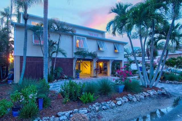 701 Marbury Ln, Longboat Key, FL 34228 - view of front of home featuring a porch