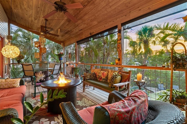 701 Marbury Ln, Longboat Key, FL 34228 - sunroom / solarium with ceiling fan, an outdoor living space with a fire pit, and vaulted ceiling