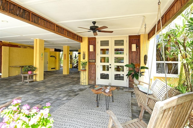 701 Marbury Ln, Longboat Key, FL 34228 - view of patio / terrace with a ceiling fan and french doors