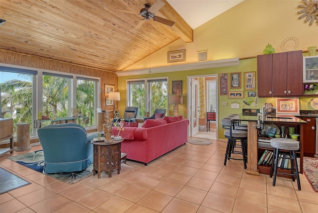 701 Marbury Ln, Longboat Key, FL 34228 - living room with light tile patterned floors, a ceiling fan, high vaulted ceiling, and beamed ceiling