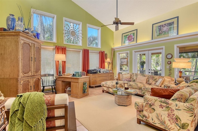 701 Marbury Ln, Longboat Key, FL 34228 - living area with high vaulted ceiling, ceiling fan, tile patterned floors, and french doors