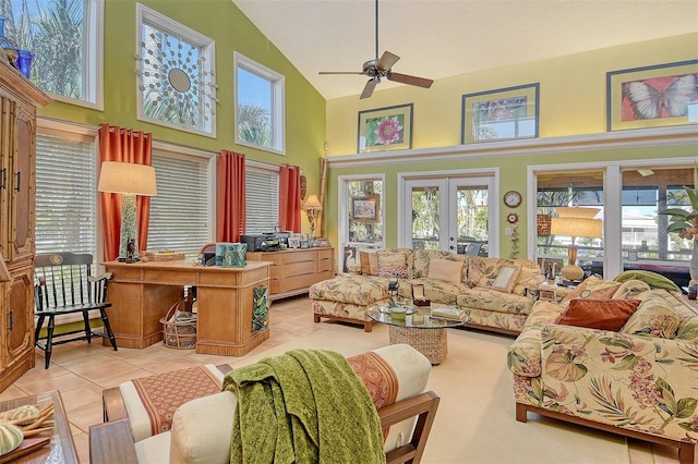 701 Marbury Ln, Longboat Key, FL 34228 - living area with high vaulted ceiling, light tile patterned flooring, a ceiling fan, and healthy amount of natural light