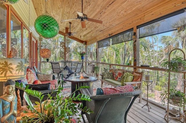 701 Marbury Ln, Longboat Key, FL 34228 - sunroom / solarium with an outdoor living space with a fire pit, a ceiling fan, and lofted ceiling