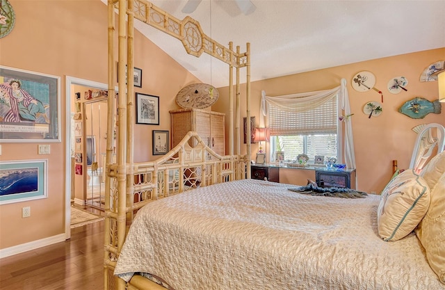 701 Marbury Ln, Longboat Key, FL 34228 - bedroom featuring wood finished floors and vaulted ceiling
