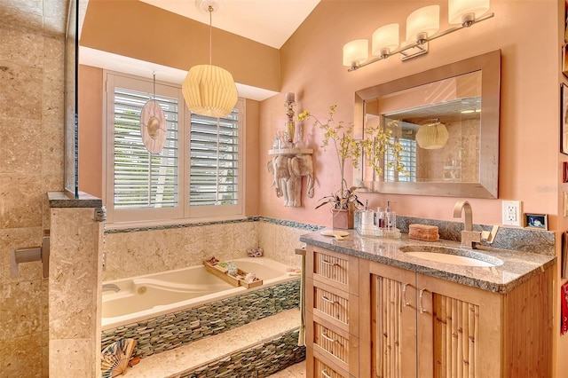 701 Marbury Ln, Longboat Key, FL 34228 - full bathroom with a garden tub and vanity