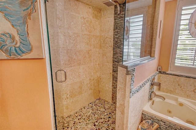 701 Marbury Ln, Longboat Key, FL 34228 - full bathroom featuring a stall shower and a tub with jets