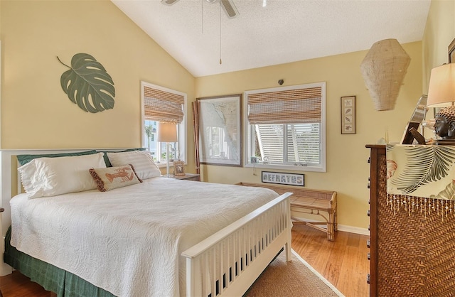 701 Marbury Ln, Longboat Key, FL 34228 - bedroom featuring wood finished floors, vaulted ceiling, and a ceiling fan