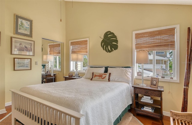 701 Marbury Ln, Longboat Key, FL 34228 - bedroom with baseboards and wood finished floors