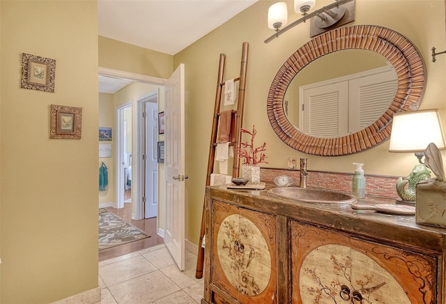 701 Marbury Ln, Longboat Key, FL 34228 - corridor with a sink and light tile patterned floors