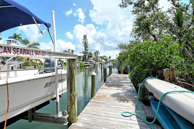 701 Marbury Ln, Longboat Key, FL 34228 - dock area featuring a water view and boat lift