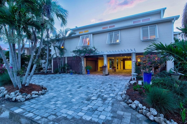 701 Marbury Ln, Longboat Key, FL 34228 - view of front of home featuring decorative driveway and a carport
