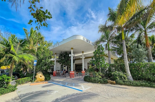 701 Marbury Ln, Longboat Key, FL 34228 - view of building exterior featuring uncovered parking