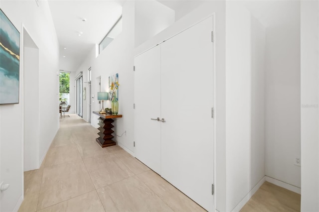 904 Virginia Dr, Sarasota, FL 34234 - hallway with light tile patterned floors and recessed lighting