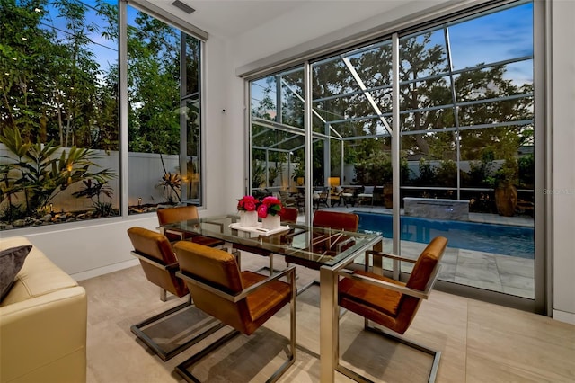 904 Virginia Dr, Sarasota, FL 34234 - sunroom featuring a jacuzzi and outdoor dining space