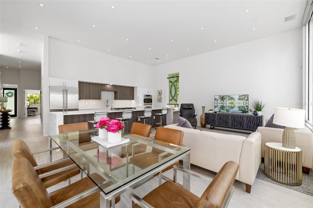 904 Virginia Dr, Sarasota, FL 34234 - dining space featuring a high ceiling and recessed lighting