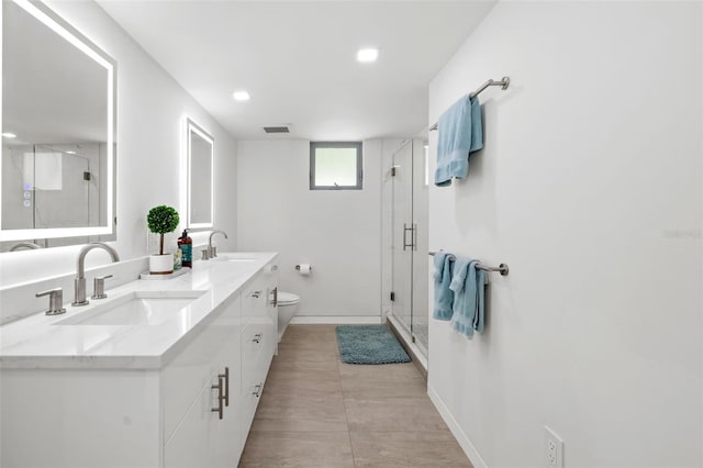 904 Virginia Dr, Sarasota, FL 34234 - full bathroom with double vanity, a shower stall, and recessed lighting