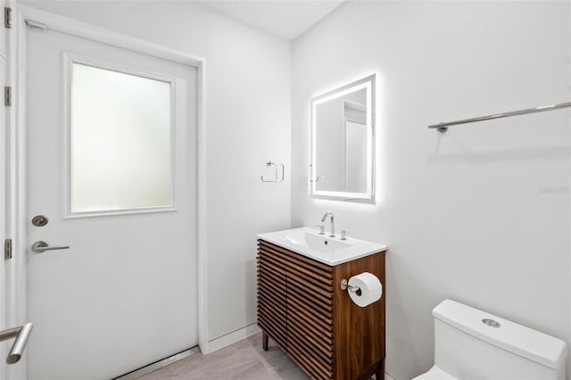 904 Virginia Dr, Sarasota, FL 34234 - half bath featuring vanity and plenty of natural light