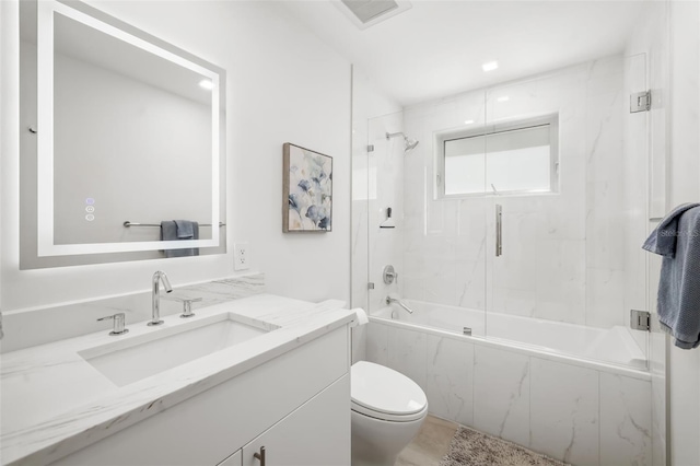 904 Virginia Dr, Sarasota, FL 34234 - bathroom with vanity and enclosed tub / shower combo