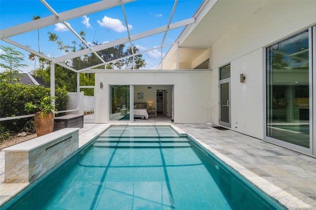 904 Virginia Dr, Sarasota, FL 34234 - swimming pool with a patio area and glass enclosure