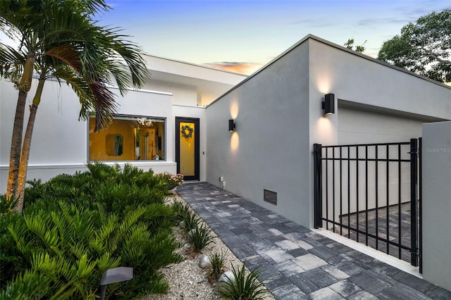 904 Virginia Dr, Sarasota, FL 34234 - view of front of house featuring stucco siding and a gate