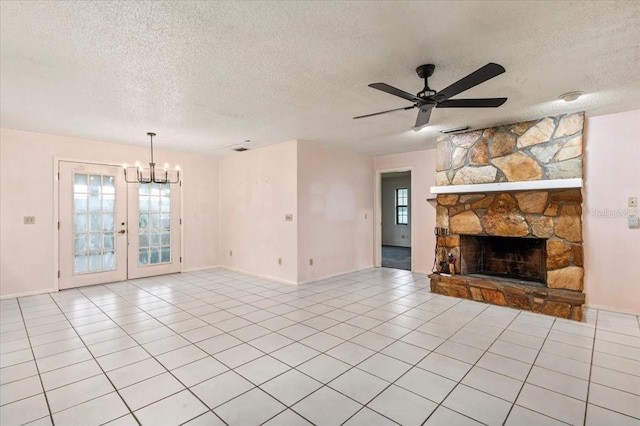 2708 Wilkinson Rd, Sarasota, FL 34231 - unfurnished living room with a textured ceiling, a chandelier, ceiling fan, french doors, and a fireplace