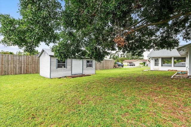 2708 Wilkinson Rd, Sarasota, FL 34231 - fenced backyard featuring a storage shed