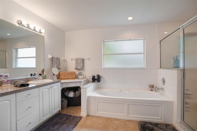 2710 93rd Ct E, Palmetto, FL 34221 - bathroom with vanity, a garden tub, tile patterned flooring, and a shower stall