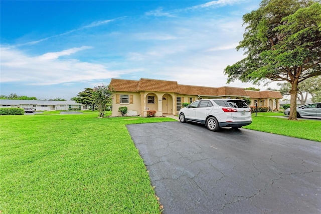 3905 34th Avenue Dr W Unit 36, Bradenton, FL 34205 - view of front of house with a front lawn and stucco siding
