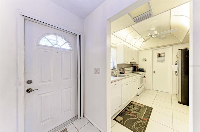 3905 34th Avenue Dr W Unit 36, Bradenton, FL 34205 - foyer entrance with light tile patterned floors and ceiling fan