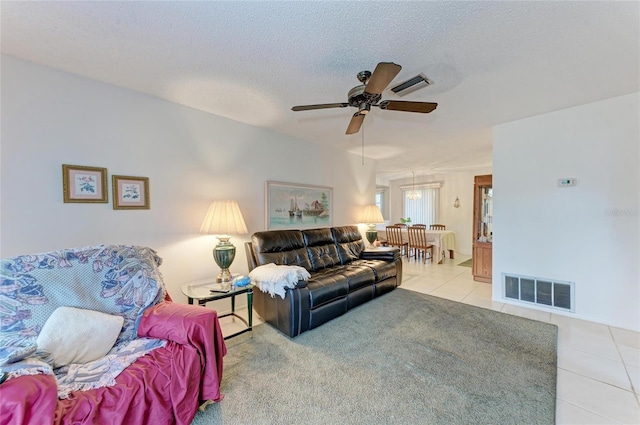 3905 34th Avenue Dr W Unit 36, Bradenton, FL 34205 - living area with tile patterned floors, a ceiling fan, and a textured ceiling