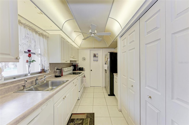 3905 34th Avenue Dr W Unit 36, Bradenton, FL 34205 - kitchen with white appliances, light tile patterned flooring, light countertops, a ceiling fan, and white cabinets