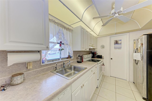 3905 34th Avenue Dr W Unit 36, Bradenton, FL 34205 - kitchen featuring white appliances, under cabinet range hood, light tile patterned floors, light countertops, and white cabinetry