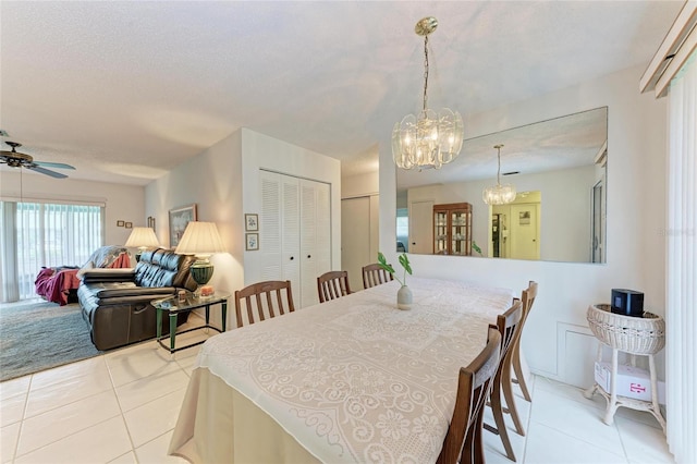 3905 34th Avenue Dr W Unit 36, Bradenton, FL 34205 - dining room with light tile patterned flooring, a chandelier, and a ceiling fan