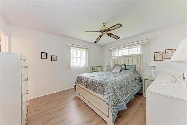 3905 34th Avenue Dr W Unit 36, Bradenton, FL 34205 - bedroom featuring light wood finished floors, ceiling fan, and a textured ceiling