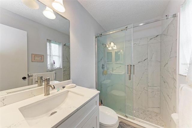 3905 34th Avenue Dr W Unit 36, Bradenton, FL 34205 - full bathroom with a marble finish shower, a textured ceiling, and vanity