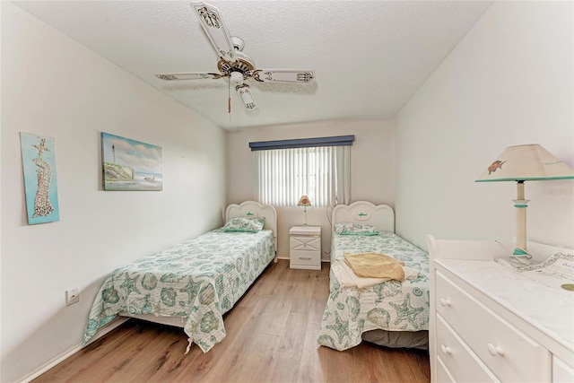 3905 34th Avenue Dr W Unit 36, Bradenton, FL 34205 - bedroom with light wood-style floors, a ceiling fan, and a textured ceiling