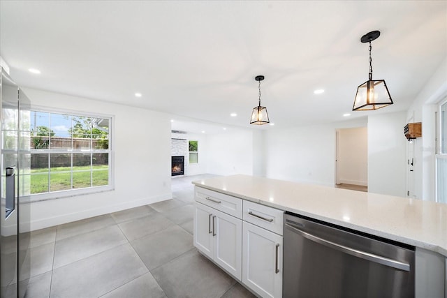 3959 Coleridge Pl, Sarasota, FL 34241 - kitchen featuring stainless steel dishwasher, open floor plan, hanging light fixtures, white cabinetry, and recessed lighting