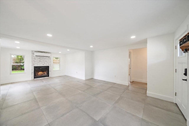 3959 Coleridge Pl, Sarasota, FL 34241 - unfurnished living room featuring an AC wall unit, a fireplace, and recessed lighting