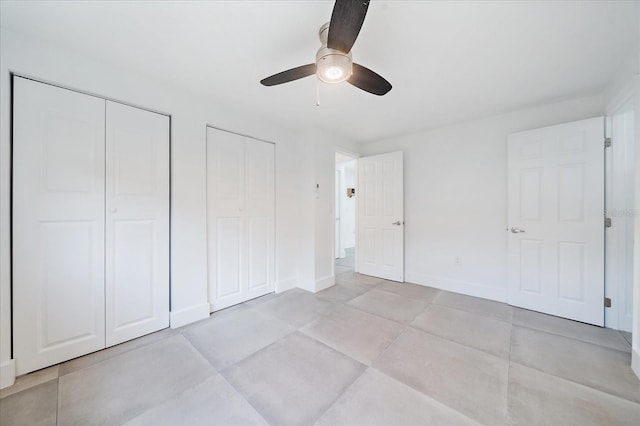 3959 Coleridge Pl, Sarasota, FL 34241 - unfurnished bedroom featuring multiple closets and ceiling fan