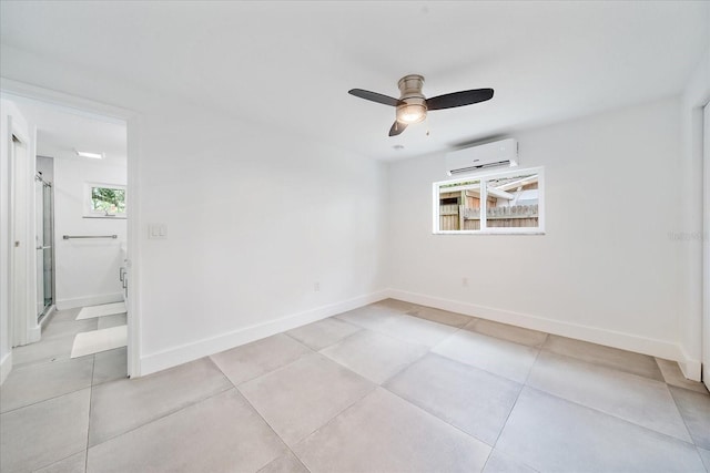 3959 Coleridge Pl, Sarasota, FL 34241 - empty room featuring an AC wall unit, healthy amount of natural light, a ceiling fan, and light tile patterned flooring