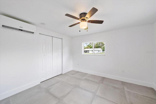 3959 Coleridge Pl, Sarasota, FL 34241 - unfurnished bedroom with a wall mounted AC, a closet, and a ceiling fan