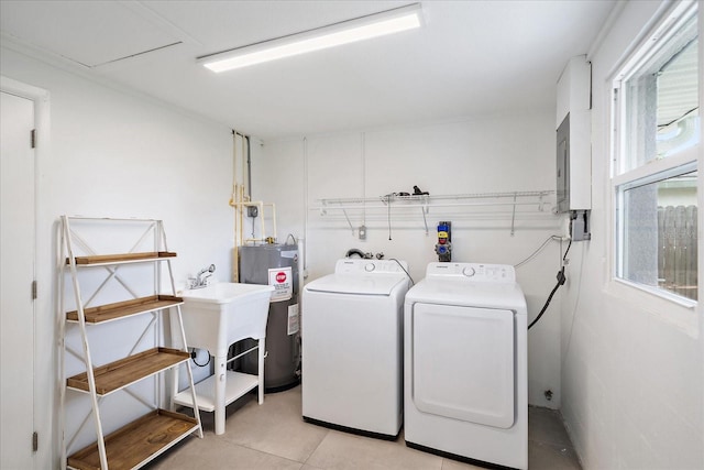 3959 Coleridge Pl, Sarasota, FL 34241 - washroom with electric water heater, washer and clothes dryer, light tile patterned floors, and electric panel