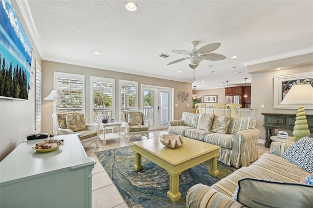 202 75th St, Holmes Beach, FL 34217 - living area with ceiling fan, recessed lighting, a textured ceiling, light tile patterned floors, and ornamental molding
