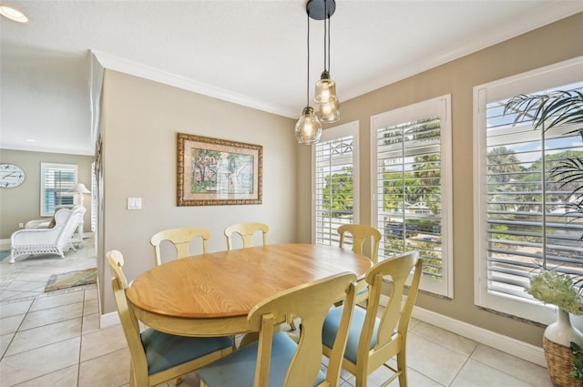 202 75th St, Holmes Beach, FL 34217 - dining area with light tile patterned floors and crown molding