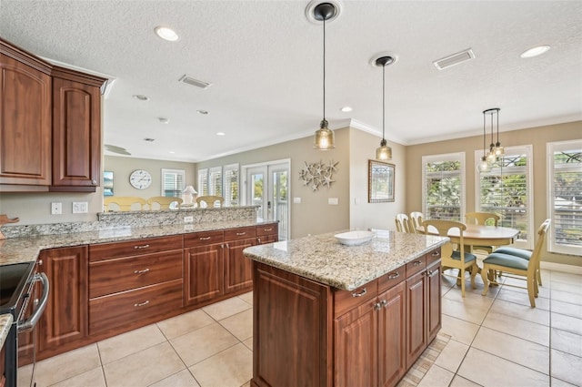 202 75th St, Holmes Beach, FL 34217 - kitchen featuring stainless steel range with electric stovetop, decorative light fixtures, healthy amount of natural light, light tile patterned floors, and recessed lighting