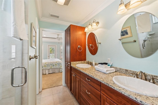 202 75th St, Holmes Beach, FL 34217 - full bathroom featuring ornamental molding, double vanity, a stall shower, tile patterned floors, and ensuite bath