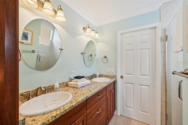 202 75th St, Holmes Beach, FL 34217 - full bathroom featuring double vanity, a shower stall, ornamental molding, and tile patterned floors