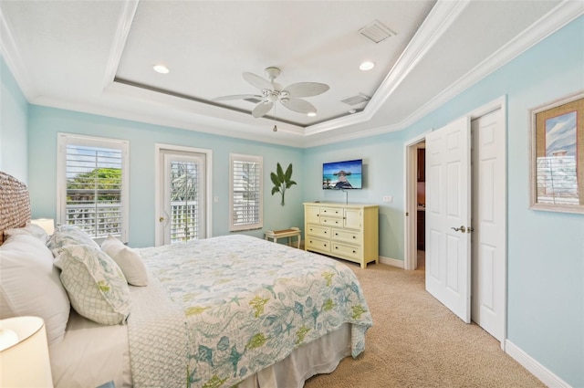 202 75th St, Holmes Beach, FL 34217 - bedroom with a raised ceiling, light colored carpet, ornamental molding, recessed lighting, and access to exterior